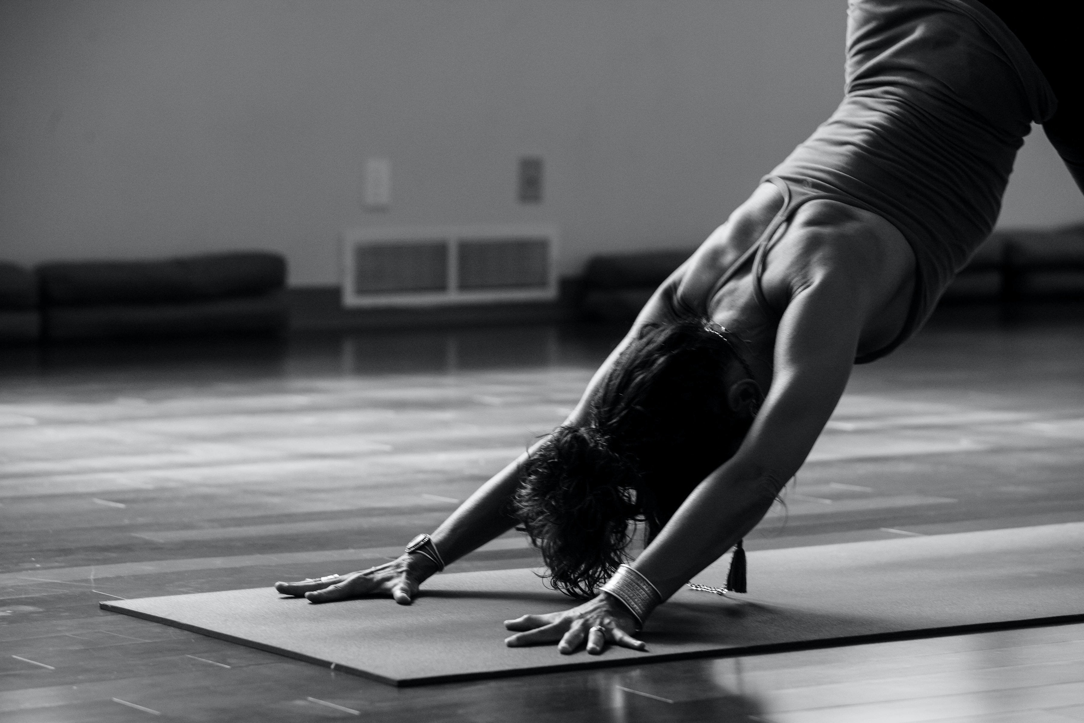 Woman doing a yoga pose on a Mizpah yoga mat